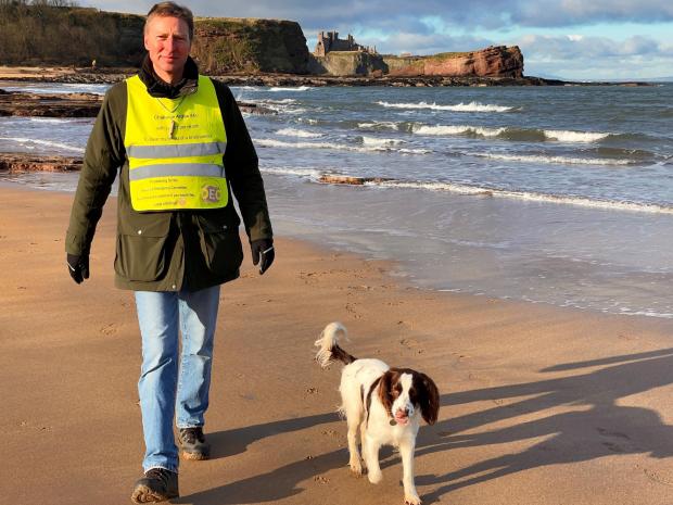 East Lothian Courier: Archie Douglas and Cocoa on Seacliff Beach. Photo: Hamish Stewart